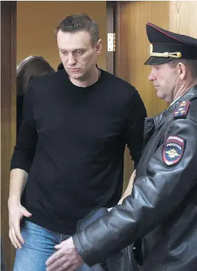  ?? — GETTY IMAGES ?? Kremlin critic Alexei Navalny, who was arrested during a March 26 anti-corruption rally, attends a hearing at a court in Moscow on Monday.