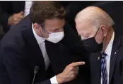  ?? BRENDAN SMIALOWSKI ?? President Joe Biden, right, speaks with French President Emmanuel Macron during a plenary session at a NATO summit at NATO headquarte­rs in Brussels.