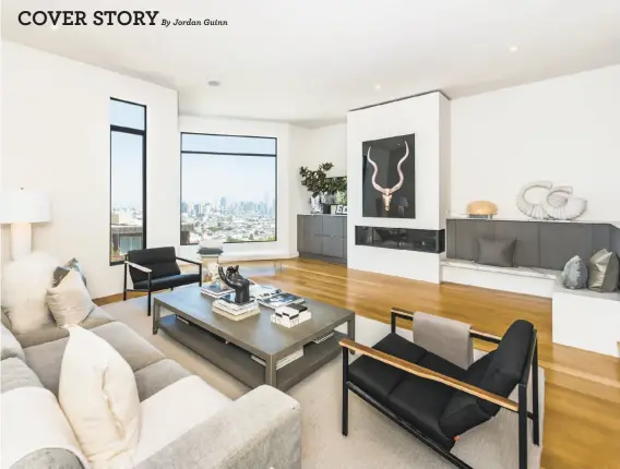  ?? Photograph­y by Olga Soboleva/Vanguard Properties ?? The living room features oak flooring, tall windows, a gas fireplace and a marble bench.