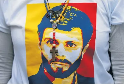  ?? /Reuters ?? War chest: An image of opposition leader Leopoldo Lopez, who was seized from his home, is seen on a T-shirt during a protest against President Nicolas Maduro’s government in Caracas, Venezuela, in April.