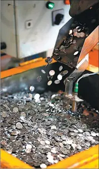  ?? PROVIDED TO CHINA DAILY ?? Coin production in progress at Shanghai Mint Co Ltd.