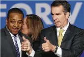  ?? Win McNamee / Getty Images ?? Virginia Gov.-elect Ralph Northam, right, and Lt. Gov.elect Justin Fairfax celebrate a Democratic victory.
