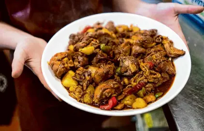  ?? Don Feria/Special to The Chronicle ?? This big plate of chicken from Mrs Khan in Menlo Park arrives with stretchy noodles.