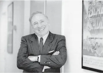  ?? NICK UT/AP ?? Actor-director-writer Mel Brooks poses next to a framed poster of his 1974 film “Blazing Saddles” in Los Angeles on July 23, 1991. Brooks has released a memoir,“All About Me!: My Remarkable Life in Show Business.”
