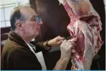  ?? — Reuters ?? Butcher Gerardo Tomsin cuts meat in his shop, in Buenos Aires, Argentina June 10, 2024.