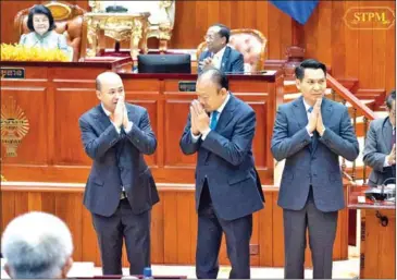  ?? NA ?? The National Assembly (NA) gives a vote of confidence for Hun Many (left) as deputy prime minister and for Sry Thamarong (centre) and Pen Vibol (right) as senior ministers on February 21.