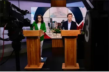  ?? HELEN H. RICHARDSON — THE DENVER POST ?? Denver mayoral candidates Kelly Brough and Mike Johnston take part in a debate in the studios of Channel 7 News on May 23.