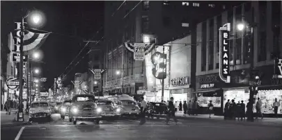  ?? THE COMMERCIAL APPEAL FILES ?? Main Street looking South toward Goldsmith’s, left center, the Malco Theater and the Hotel Chisca in Downtown Memphis in a photograph dated Sept. 30, 1954.