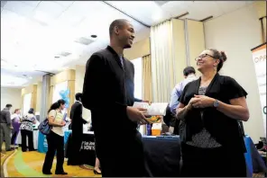  ?? AP/MARCIO JOSE SANCHEZ ?? A recruiter for Big 5 Sporting Goods (right) talks with a job seeker at a job fair on Aug. 24 in San Jose, Calif. The U.S. economy rebounded in the spring, expanding at a 3 percent annual pace.