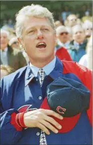  ?? THE ASSOCIATED PRESS FILE ?? President Bill Clinton sings the national anthem on opening day at Jacobs Field on April 4, 1994. Clinton threw out the ceremonial first pitch.