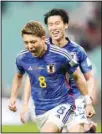  ?? ?? Japan’s Ritsu Doan celebrates after scoring his side’s opening goal during the World Cup group E soccer match between Germany and Japan, at the Khalifa Internatio­nal Stadium in Doha, Qatar. (AP)