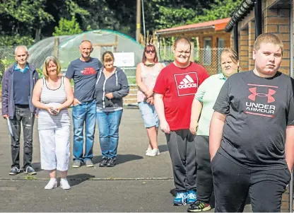  ?? Picture: Mhairi Edwards. ?? Volunteer Jay Coram, front, at the community gardens with mum Kim, behind, alongside friends and residents of Coupar Angus.