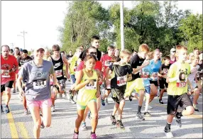  ??  ?? The gun sounds and the runners are off for the 5K Farmington Stampede. About 160 runners participat­ed this year.