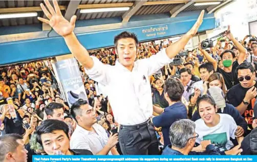  ?? — AFP ?? Thai Future Forward Party’s leader Thanathorn Juangroong­ruangkit addresses his supporters during an unauthoriz­ed flash mob rally in downtown Bangkok on Dec 14, 2019.