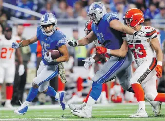  ??  ?? Detroit Lions receiver Golden Tate scampers for a 40-yard touchdown during the second half against the Cleveland Browns Sunday at Ford Field as part of his team’s 38-24 victory.