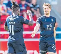  ?? Picture: SNS. ?? Dundee’s Craig Wighton celebrates his goal with team-mate Jean Mendy.