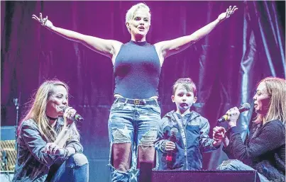  ?? Pictures: Steven Brown. ?? Four-year-old Aaron O’Neil from Rosyth gets a surprise starring tole when he joined Atomic Kitten on the stage.