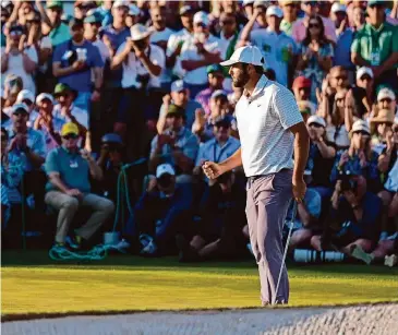  ?? Ashley Landis/Associated Press ?? Scottie Scheffler celebrates after his birdie on the 18th hole during the third round at at Augusta gave him a 71 and a one-stroke lead heading to Sunday’s final round of The Masters.