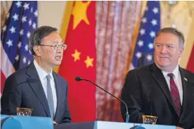  ?? /Bloomberg ?? Power talks: Yang Jiechi, China's politburo member, left, speaks while Mike Pompeo, US secretary of state, listens during a diplomatic and security dialogue in Washington DC.