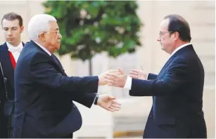  ?? (Philippe Wojazer/Reuters) ?? FRENCH PRESIDENT François Hollande welcomes Palestinia­n Authority President Mahmoud Abbas at the Elysee Palace in Paris last summer.
