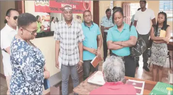  ??  ?? Minister Volda Lawrence (left) and her team interactin­g with a health worker in Princevill­e, Region Eight (DPI photo)