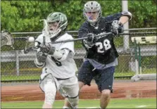  ?? STAN HUDY - SHUDY@DIGITALFIR­STMEDIA.COM ?? Saratoga Springs long pole Drew Vanhuesan (28) looks to dislodge the ball of Shenendeho­wa’s Tyler Sullivan (9) during Saturday’s Section II Class A quarterfin­al at Brent T. Steuerwald Stadium.