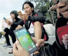  ?? ASSOCIATED PRESS FILES ?? An Indonesian man shows his smartphone as he plays Pokemon Go in Jakarta, Indonesia. Google has announced that it wants to turn its Android operating system into a major gaming centre.