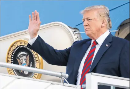  ?? AP PHOTO ?? U.S. President Donald Trump waves as he arrives at the airport in Helsinki, Finland, Sunday, on the eve of his meeting with Russian President Vladimir Putin.