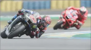  ?? (AFP) ?? Monster Energy Yamaha MotoGP French rider Fabio Quartararo (pole position) steers his motorbike ahead of Ducati Team Australian’s rider Jack Miller during the Q2 qualifying session of the MotoGP, ahead of the French Moto GP Grand Prix in Le Mans, France, on Saturday.