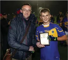  ??  ?? Brendan Lawrence presents Killian O’Keeffe with the Wicklow People sponsorede Man of the Match award.