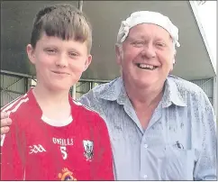  ?? ?? Denis Cashman playing with Cork’s Primary Game team and John Arnold wearing Oriental Sun Protection Gear.