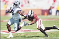  ?? Ian Maule / Associated Press ?? Kansas State running back Jacardia Wright stiff arms Oklahoma defensive back Tre Brown on Saturday.