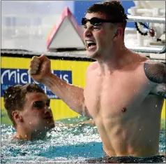  ??  ?? Adam Peaty celebrates after smashing his own record