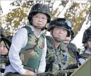  ?? Sam Yeh AFP/Getty Images ?? PRESIDENT Tsai Ing-wen, watching live-fire war games in May, has faced tense relations with China.