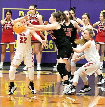  ?? Staff photograph by Mark Humphrey ?? Lady Blackhawk Hayley West passes out of the post after drawing Farmington defenders during the Lady Blackhawks’ 56-33 loss in the 4A North Regional semifinal Friday at Berryville’s Bobcat Arena. Pea Ridge came back Saturday with a win over Ozark to take third place and advance to the State 4A girls basketball tournament. The Lady Blackhawks, seeded No. 3 North, take on No. 4 South Mena Wednesday at 4 p.m. at Cardinal Arena.