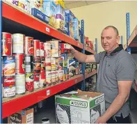  ??  ?? Gilbert Grieve in the stock room at Moray Foodbank