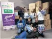  ?? Supplied ?? THE Dis-Chem Foundation and Million Comforts recently delivered a shipment of 3 million sanitary towels to the Imbumba Foundation for distributi­on through their Caring4Gir­ls Programme. |