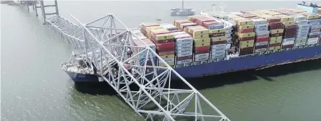  ?? NTSB VIA AP ?? Cargo ship Dali is stuck under part of the Francis Scott Key Bridge after the ship hit the bridge on Tuesday in Baltimore.