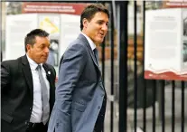  ?? JUSTIN TANG/CANADIAN PRESS VIA AP ?? Canadian Prime Minister Justin Trudeau arrives on Parliament Hill in Ottawa, Ontario, on Monday. The U.S. and Canada reached a free trade deal despite fraught relations between Trudeau and President Donald Trump.