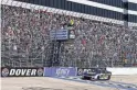  ?? MATTHEW OHAREN/USA TODAY SPORTS ?? Chase Elliott crosses the finish line to win the DuraMAX Drydene 400 on Monday at Dover Motor Speedway.