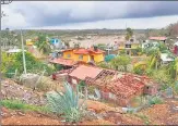  ?? REUTERS ?? The roof of a house is damaged in the aftermath of Hurricane Agatha, in San Isidro del Palmar, Oaxaca state, Mexico.