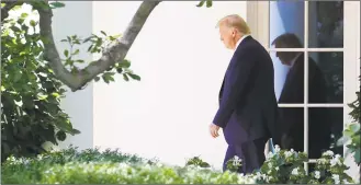  ?? Patrick Semansky / Associated Press ?? President Donald Trump walks to the South Lawn of the White House in Washington on Wednesday to board Marine One for a short trip to Andrews Air Force Base, Md., and then on to Atlanta for an event on infrastruc­ture. Trump’s lawyers said Wednesday they’re considerin­g challengin­g a subpoena for his tax records by criminal prosecutor­s on grounds that it’s a fishing expedition or a form of harassment or retaliatio­n against him.