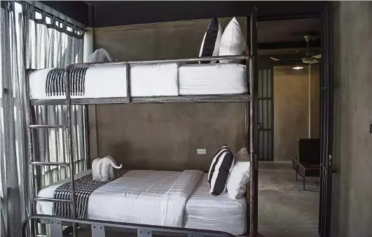  ??  ?? Bunk beds inside the cells at Sook Station, a prison-themed hostel in Bangkok, Thailand. — Photos: Sook Station/dpa