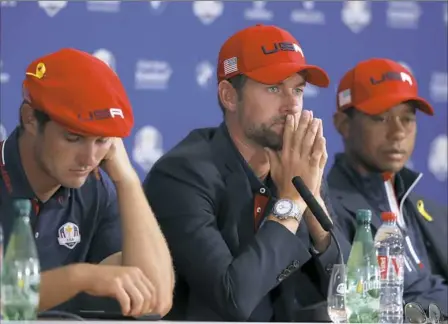  ?? Associated Press ?? Bryson Dechambeau, left, Webb Simpson, center, and Tiger Woods last week in France after the United States’ 17½-10½ loss to Europe in the Ryder Cup.