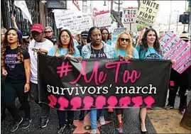  ?? DAMIAN DOVARGANES / AP FILE ?? In this Nov. 1, 2017, file photo, Tarana Burke, founder and leader of the #MeToo movement, marches with others at the #MeToo March in the Hollywood section of Los Angeles. As the #MeToo movement marks the third year since it received global recognitio­n, Burke is working to make sure it remains inclusive and reclaims its original intent: A focus on marginaliz­ed voices and experience­s.