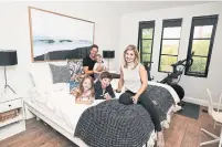  ?? ANDREW FRANCIS WALLACE TORONTO STAR ?? NOW: Jamie and Tyler Keenan added a third-storey bedroom retreat for their own haven “with no kids’ toys,” said Jamie.