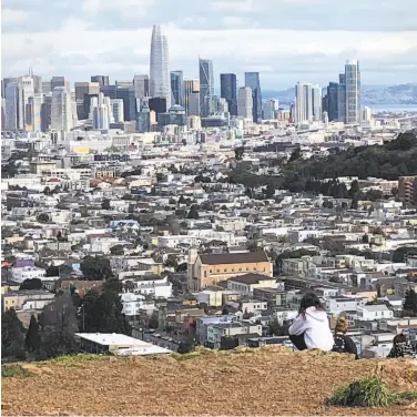  ?? Carl Nolte / The Chronicle ?? Bernal Hill provides a perfect place to savor the San Francisco landscape and contemplat­e our existence.