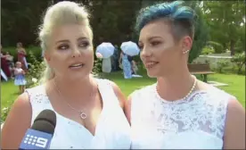  ?? The Associated Press ?? In this image made from video, newlywed couple Amy Laker, left, and Lauren Price are interviewe­d during their wedding Saturday in Sydney, Australia.