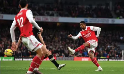  ?? ?? Reiss Nelson pulls the trigger and scores to seal Arsenal’s 3-2 win against Bournemout­h. Photograph: Shaun Botterill/Getty Images