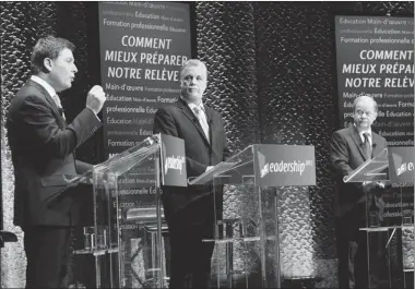  ?? MARIE-FRANCE COALLIER/ THE GAZETTE ?? Pierre Moreau, left, Philippe Couillard and Raymond Bachand square off Sunday in the second Quebec Liberal Party debate.